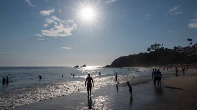 People flocked to the coastline at Crescent Bay Beach to try to beat the heat during a record heat wave on September 7, 2024 in Laguna Beach, California.