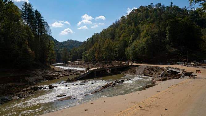 A bridge and road are washed away in Bee Log, Burnsville, North Carolina, October 6, 2024, in the aftermath of Hurricane Helene.