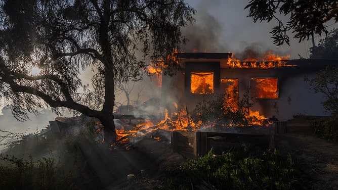 A house burns down in the Mountain Fire on November 6, 2024 in Camarillo, California.