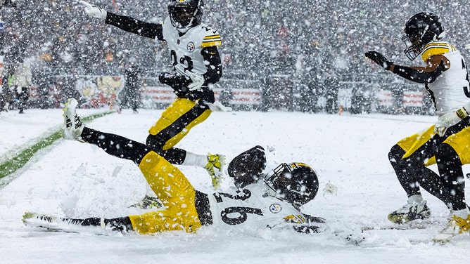 Donte Jackson #26 of the Pittsburgh Steelers slides into the end zone after intercepting a pass in the second half of the game against the Cleveland Browns at Huntington Bank Field on November 21, 2024 in Cleveland, Ohio.