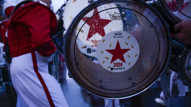 NEW YORK, NEW YORK - NOVEMBER 28: Revelers gather as rain falls before the Annual Thanksgiving Day Parade on November 28, 2024 in New York City.