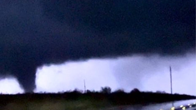 This image shows a tornado being illuminated by lightning between Byers, Texas and Waurika, Oklahoma, on Sunday, Nov. 3, 2024.