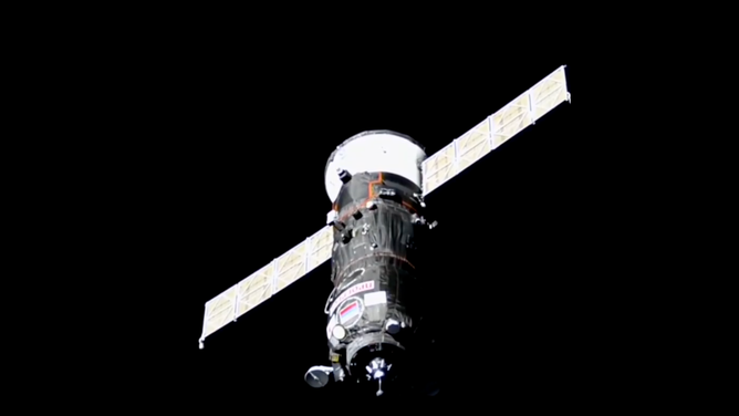 The Progress 90 cargo craft carrying nearly three tons of food, fuel, and supplies approaches the International Space Station for a docking to the Poisk module. (Credit: NASA+)