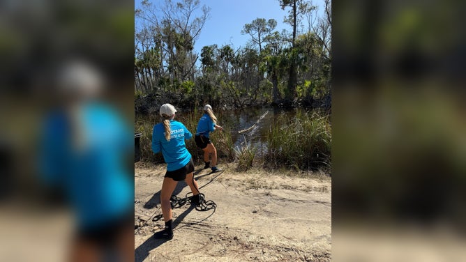 ZooTampa workers pull Gully from where he was trapped.