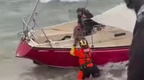 Coast Guard rescues man, dog from sailboat run aground in Washington