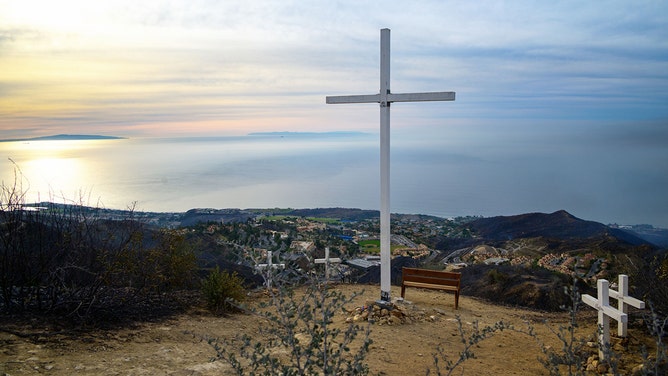 Perched atop a hill overlooking the beach community of Malibu, a white cross has become an enduring symbol of hope and resilience for the Pepperdine University community.