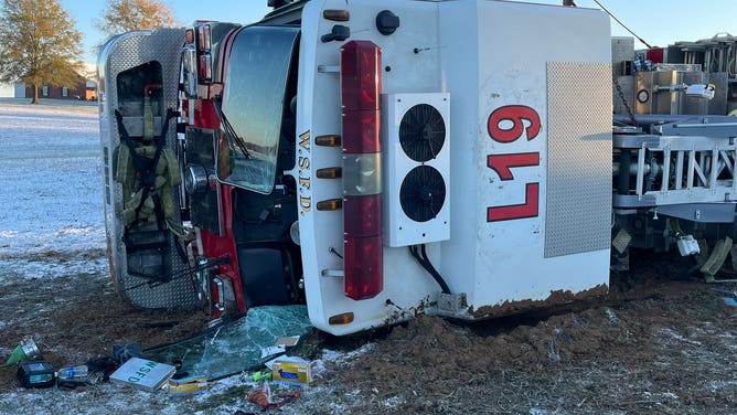 The overturned fire truck.