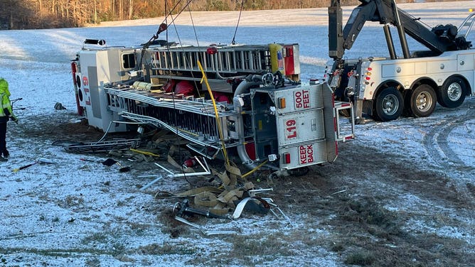 The overturned fire truck.