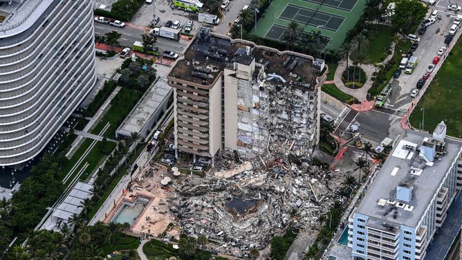 This aerial view, shows search and rescue personnel working on site after the partial collapse of the Champlain Towers South in Surfside, north of Miami Beach, on June 24, 2021.