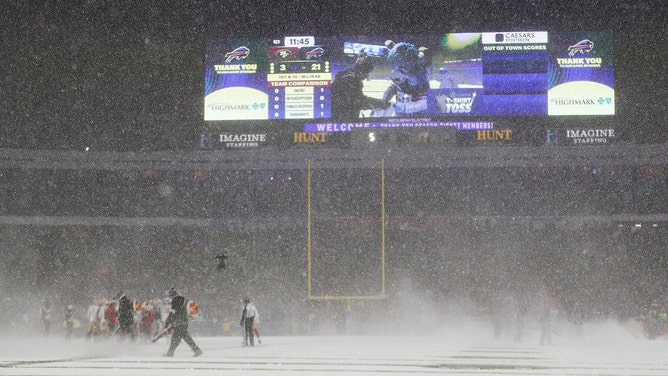 ORCHARD PARK, NEW YORK - DECEMBER 01: Snow is cleared off the field during a timeout in the third quarter of a game between the Buffalo Bills and the San Francisco 49ers at Highmark Stadium on December 01, 2024 in Orchard Park, New York.