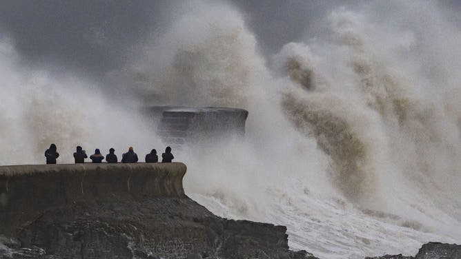 PORTHCAWL, WALES - DECEMBER 7: Waves crash against the harbour wall on December 7, 2024, in Porthcawl, Wales. Storm Darragh is the fourth named storm of this season and is expected to bring gusts of wind up to 80mph and heavy rain through the weekend. (Photo by Matthew Horwood/Getty Images)