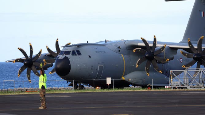 The French A440M military aircraft transporting members of the Members of the French Civil protection and French firefighters and medical and emergency equipment, lands on the tarmac as part of an emergency response to bring aid to the small French Indian Ocean territory of Mayotte, almost cut off from the world after the passage of cyclone Chido, at the French Air Force Base 181 Saint-Denis-La Reunion "Lieutenant Roland Garros" in Sainte-Marie, on the French Indian Ocean island of La Reunion, on December 15, 2024.