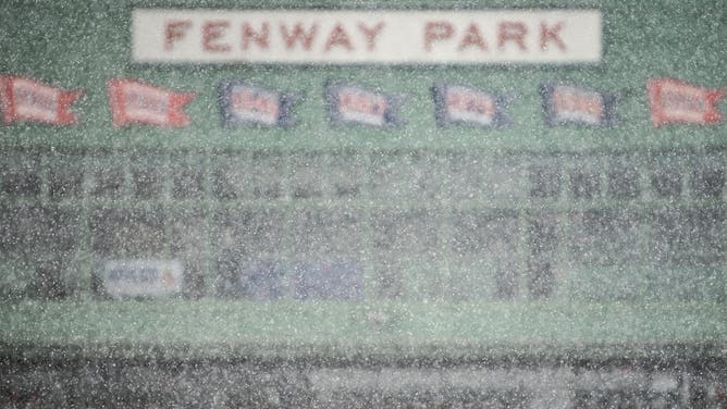 Snow falls at Fenway Park in Boston, Massachusetts.