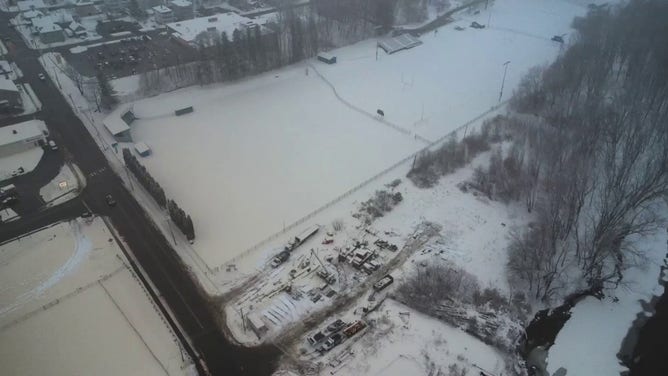 This photo shows the ground in Rumford, Maine, coated with brown and tan snow after a malfunction at a paper mill on Tuesday, Dec. 10, 2024.