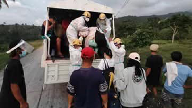 The photo provided by the Philippines Office of Civil Defense shows the evacuation of resident living near the Kanlaon Volcano after an explosive eruption on Monday, Dec. 9, 2024.