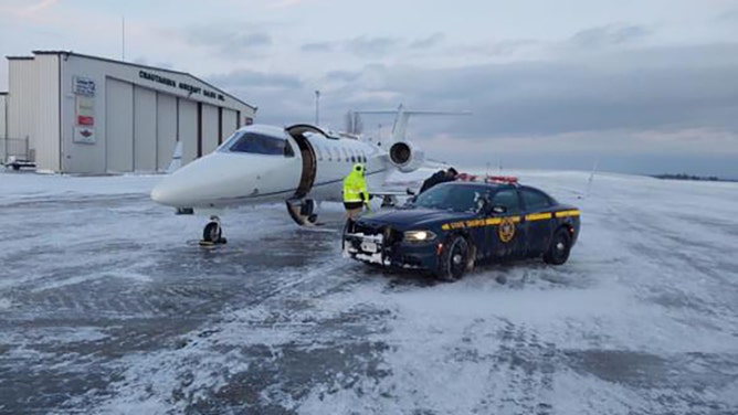 New York State troopers braved a severe holiday winter storm to save the life of a woman desperately needing a life-saving heart transplant.