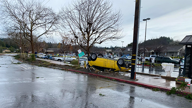 This photo shows a car flipped onto its roof after a tornado in Scotts Valley, Calif., on Saturday, Dec. 14, 2024.