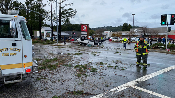 This photo shows debris on the road and a car that flipped onto its roof after a tornado in Scotts Valley, California, on Saturday, Dec. 14, 2024.