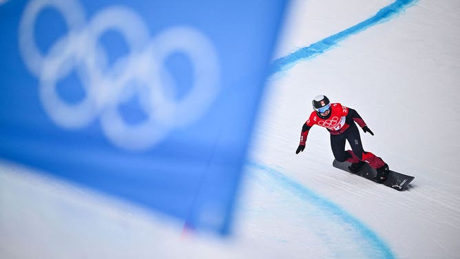 Switzerland's Sophie Hediger competes in the snowboard women's cross seeding run during the Beijing 2022 Winter Olympic Games at the Genting Snow Park P & X Stadium in Zhangjiakou on February 9, 2022.