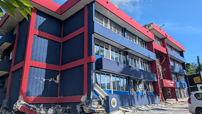 This photo shows a general view of a severely damaged building housing the embassies of the United States, United Kingdom, and New Zealand after a powerful earthquake struck Port Vila, the capital city of Vanuatu, on December 17, 2024. A powerful earthquake hit the Pacific island of Vanuatu on December 17, smashing buildings in the capital Port Vila including one housing the US and other embassies, with a witness telling AFP of bodies seen in the city. (Photo by AFP) (Photo by STR/AFP via Getty Images)