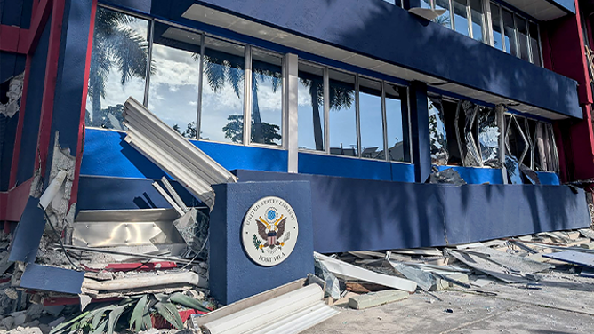 This photo shows a general view of a severely damaged building housing the embassies of the United States, United Kingdom, and New Zealand after a powerful earthquake struck Port Vila, the capital city of Vanuatu, on December 17, 2024. A powerful earthquake hit the Pacific island of Vanuatu on December 17, smashing buildings in the capital Port Vila including one housing the US and other embassies, with a witness telling AFP of bodies seen in the city. (Photo by AFP) (Photo by STR/AFP via Getty Images)