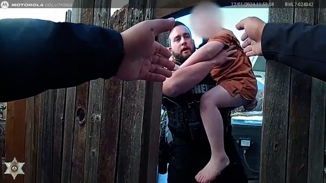 Arapahoe County Sheriff’s Office deputies Ryan McConnell and Chris Calderon displayed extraordinary bravery when they rescued two young siblings trapped in their snowy backyard on Sunday as their home burned. Dramatic body camera footage captures the harrowing scene.