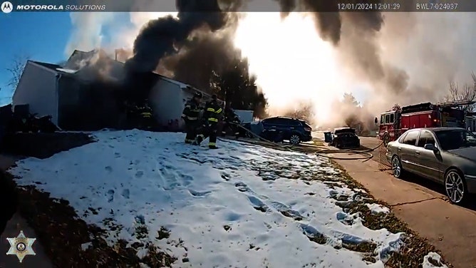 Arapahoe County Sheriff’s Office deputies Ryan McConnell and Chris Calderon displayed extraordinary bravery when they rescued two young siblings trapped in their snowy backyard on Sunday as their home burned. Dramatic body camera footage captures the harrowing scene.