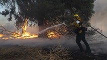 Wildfire siege continues in Southern California as pockets of beneficial weekend rain near