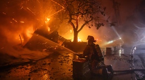 Catastrophic wildfires fueled by near 100-mph winds force thousands to flee near Los Angeles