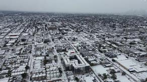 Drone video: Houston transformed into snow-globe scene during historic winter storm