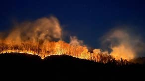 Downed power line during gusty winds erupts wildfires in Helene-ravaged area of North Carolina