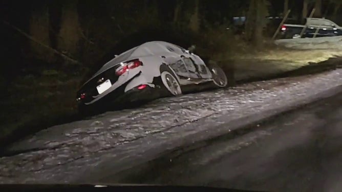 This image shows a car off the side of the road in Atlanta after a winter storm on Wednesday, Jan. 22, 2025.