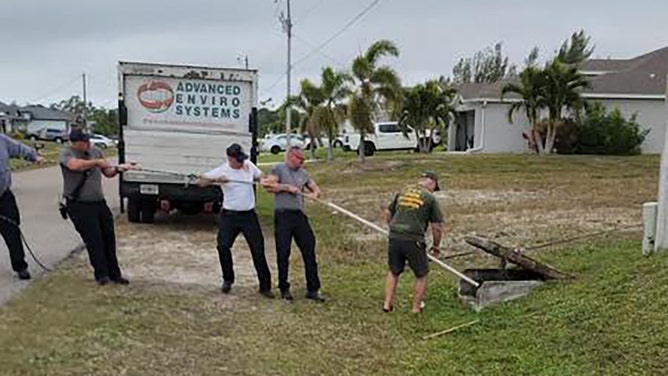 Things got interesting in a Florida neighborhood over the weekend after a monstrous alligator became trapped in a storm drain, triggering a frightening rescue operation.