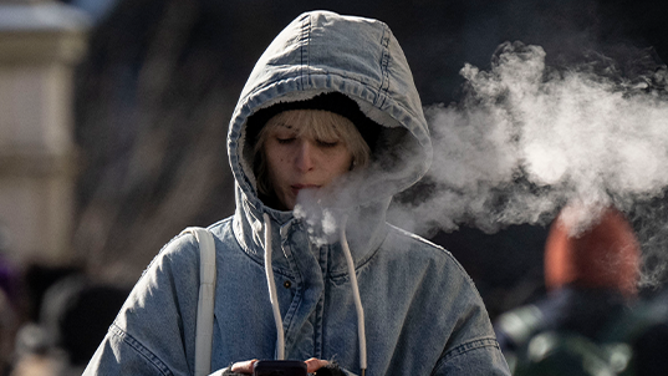 FILE - A person walks in freezing cold temperatures in New York City on January 17, 2024. (Photo by ANGELA WEISS / AFP) (Photo by ANGELA WEISS/AFP via Getty Images)