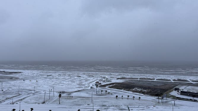 Snow covers the ground near Stewart Beach on Galveston Island, Texas, on Jan. 21, 2025.