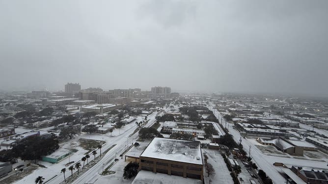 Snow covers the ground near Stewart Beach on Galveston Island, Texas, on Jan. 21, 2025.