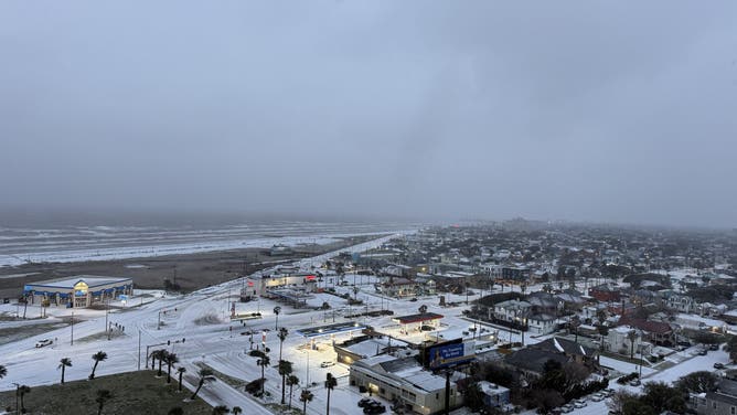 Snow covers the ground near Stewart Beach on Galveston Island, Texas, on Jan. 21, 2025.