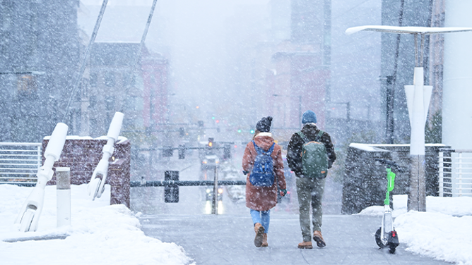FILE - Snow covers Denver Millennium Bridge and downtown in Denver, Colorado on Friday, November 8, 2024. (Photo by Hyoung Chang/The Denver Post)