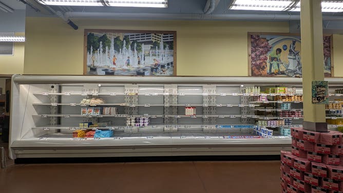 Empty store shelves in Kansas City as shoppers prepare for a winter storm.