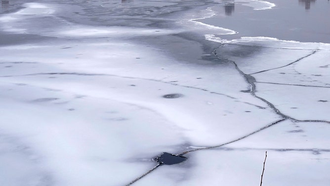 Ice sheets begin to form on the Jacqueline Kennedy Onassis Reservoir in Central Park on a rainy day on February 7, 2022 in New York City.