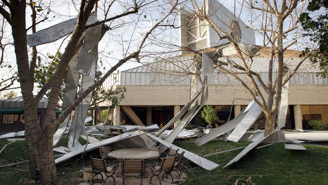 PASADENA, CA - DECEMBER 1: Metal panels that were blown off the roof of the First Church of the Nazarene litter the grounds as strong Santa Ana Winds cause the worst local wind damage in decades on December 1, 2011 in Pasadena, California. As many as 230,000 were without power and the city of Pasadena closed schools and declared a state of emergency. (Photo by David McNew/Getty Images)