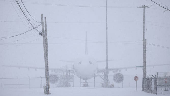 LOUISVILLE, KENTUCKY - JANUARY 5: A FedEx Corp. cargo jet sits parked in the snow at Louisville Muhammad Ali International Airport on January 5, 2025 in Louisville, Kentucky. Local forecasts called for heavy snowfall followed by significant accumulation of freezing rain and ice. (Photo by Luke Sharrett/Getty Images)