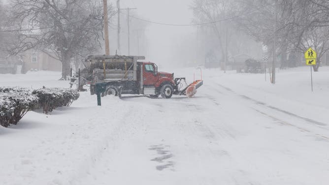 SHAWNEE, KANSAS - JANUARY 5: A salt and plow truck pulls onto a road on January 5, 2025 in Shawnee, Kansas. A large swath of the U.S., across the Midwest to the East Coast is experiencing a major Winter storm, with more than two feet of snow in some areas. A state of emergency has been declared in Kentucky and Virginia. (Photo by Chase Castor/Getty Images)