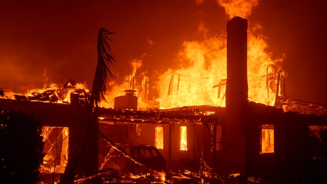 Flames from the Palisades Fire burn a home on January 7, 2025 in the Pacific Palisades neighborhood of Los Angeles, California.