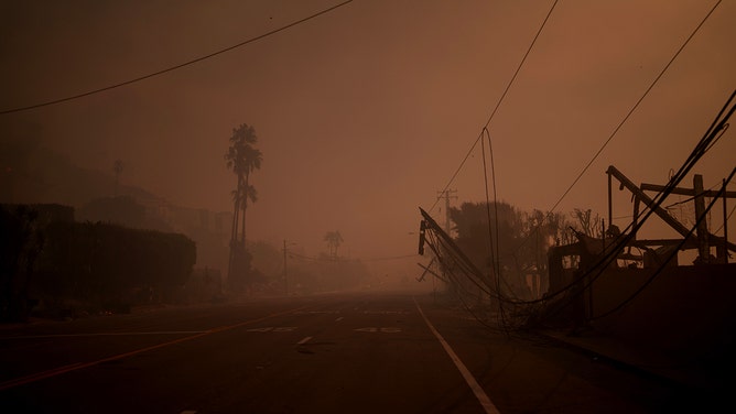 Pacific Coast Highway is seen in smoke from the Palisades Fire on January 8, 2025 in Malibu, California.