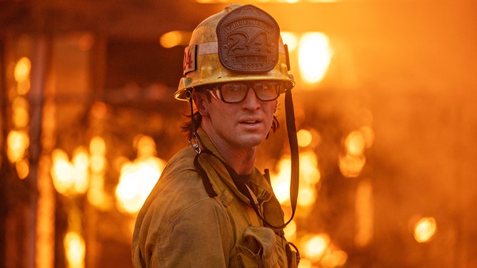 A firefighter works the Eaton fire on Wednesday, Jan. 8, 2025 in Altadena, CA.