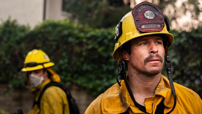 Orange County and Los Angles County firefighters work to save homes within the Palisades Fire zone in Pacific Palisades, California on Thursday January 9, 2025.