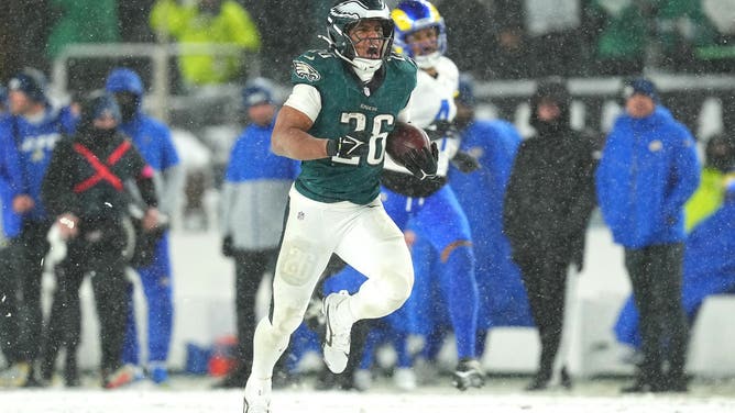 PHILADELPHIA, PENNSYLVANIA - JANUARY 19: Saquon Barkley #26 of the Philadelphia Eagles runs the ball for a 78-yard touchdown against the Los Angeles Rams during the fourth quarter in the NFC Divisional Playoff at Lincoln Financial Field on January 19, 2025 in Philadelphia, Pennsylvania.