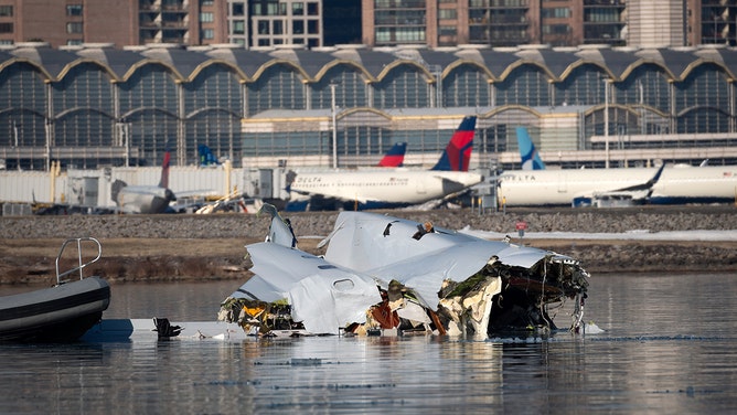 In this U.S. Coast Guard handout, the Coast Guard investigates aircraft wreckage on the Potomac River on January 30, 2025 in Washington, DC. An American Airlines flight from Wichita, Kansas collided midair with a military Black Hawk helicopter while on approach to Ronald Reagan Washington National Airport outside of Washington, DC. According to reports, there were no survivors among the 67 people onboard both aircraft.