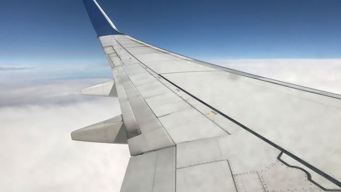 Airplane Wing In The Clouds